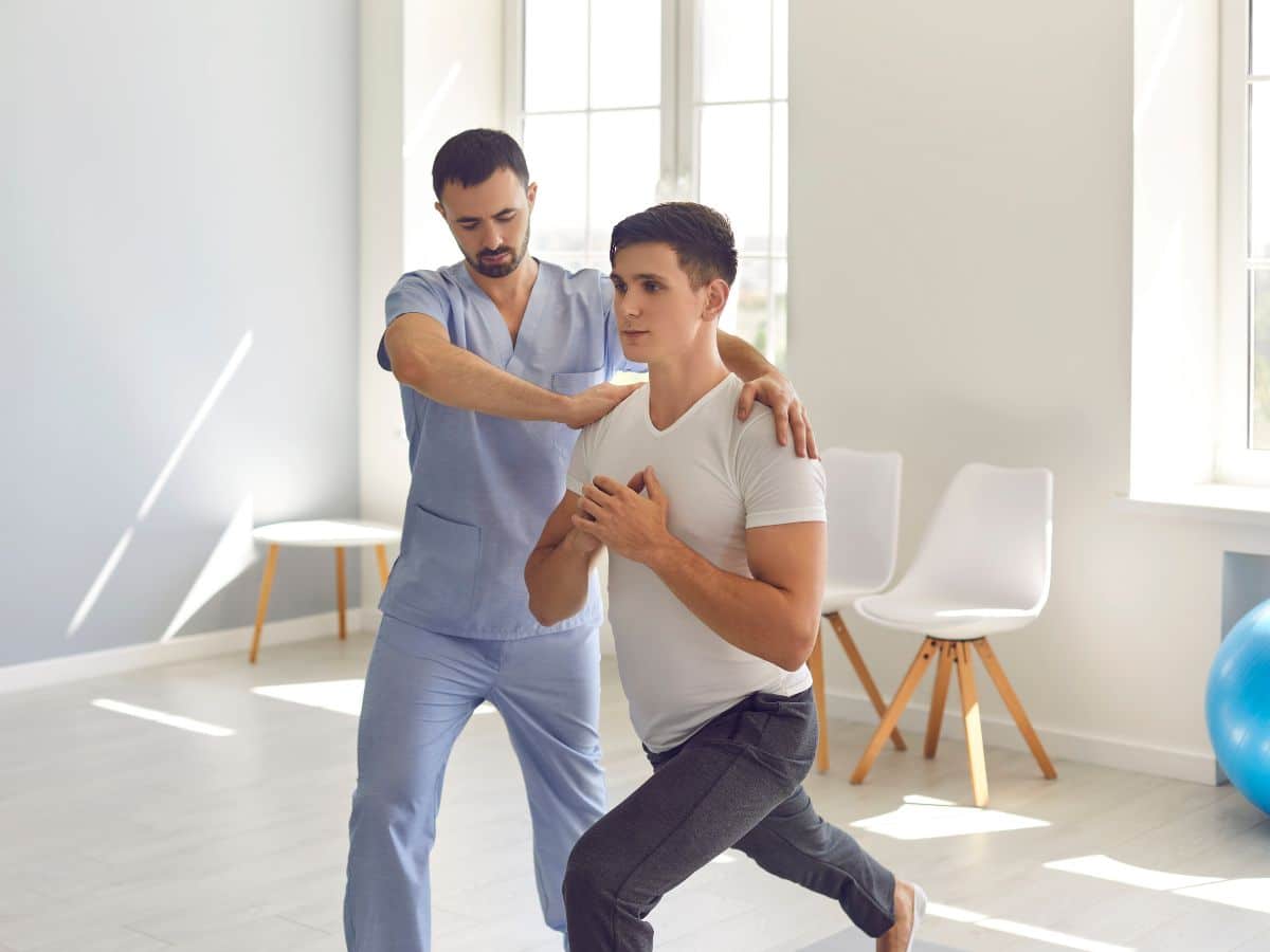 A physiotherapist helping the patient